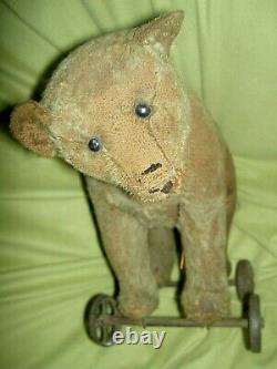 STEIFF antique, ride-on, mohair teddy BEAR? On iron wheels, shoe button eyes